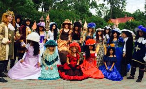 NSLI-Y students at the Preili Museum of Dolls in full regalia